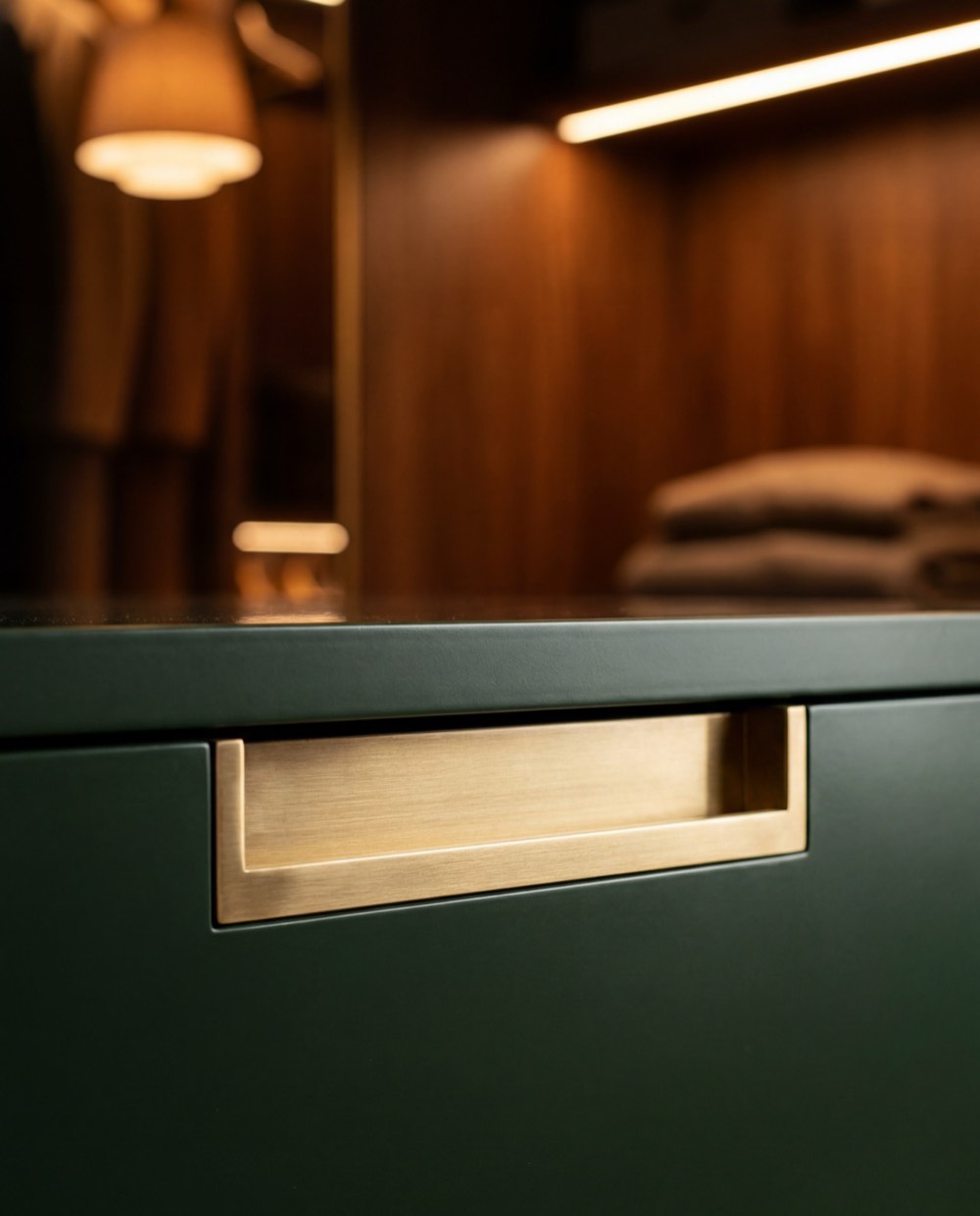 Brass hardware set flush in dark timber