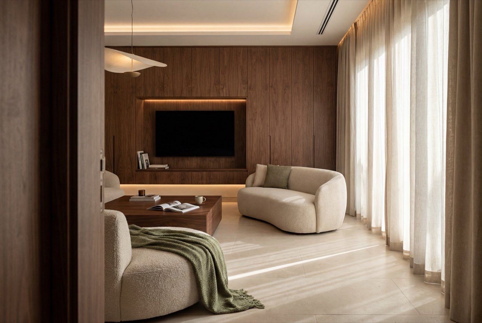 The main living room of a villa rebuilt from the shell, morning light across walnut panelling